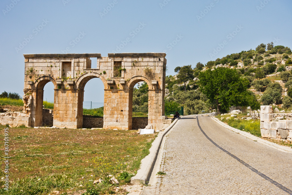Ruins of city gate near the road to arheological site of ancient Lycian city of Patara, Lycia, Turkey