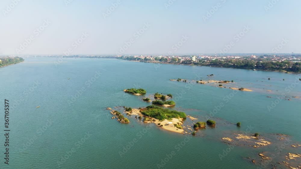 The islands in the middle of the Mekong at Stoeng Treng in Asia, Cambodia, towards Siem Reap, in summer, on a sunny day. The islands in the middle of the Mekong at Stoeng Treng in Asia, Cambodia, towards Siem Reap, in summer, on a sunny day.