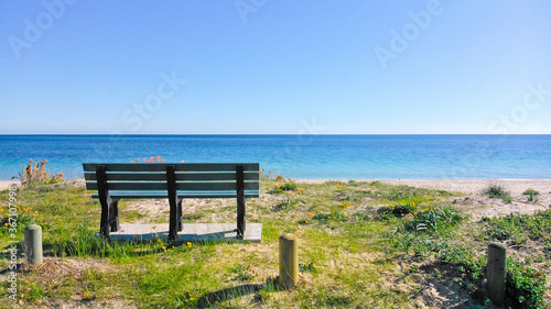 Wooden bench by the beach