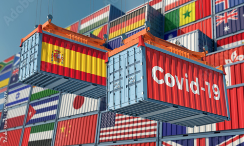 Container with Coronavirus Covid-19 text on the side and container with Spain Flag. Concept of international trade spreading the Corona virus. 3D Rendering © Marius Faust