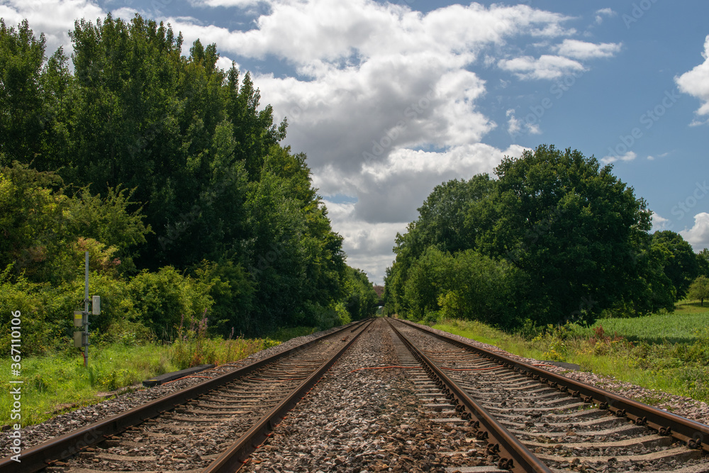 Perspective view up a twin track railway in the English countryside Perspective view up a twin track railway in the English countryside