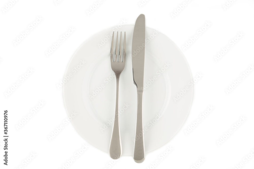 Dining etiquette - the meal is over or finished. Fork and knife signals with location of cutlery set. Photo isolated on white background. Set of foto 1 from 7 Dining etiquette - the meal is over or finished. Fork and knife signals with location of cutlery set. Photo isolated on white background. Set of foto 1 from 7