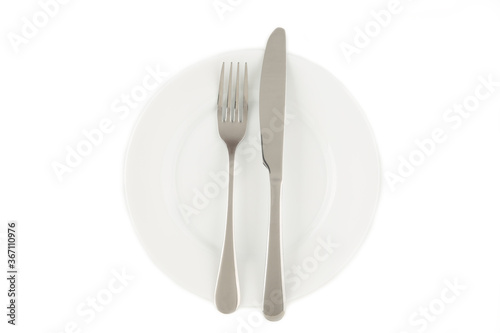 Dining etiquette - the meal is over or finished. Fork and knife signals with location of cutlery set. Photo isolated on white background. Set of foto 1 from 7