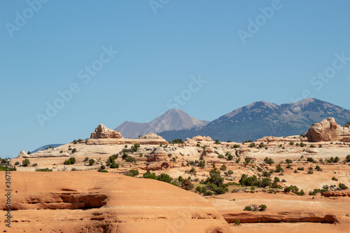 Beautiful landscape in natural colors along Highway 191 in Utah. Sandstone rocks and mountains