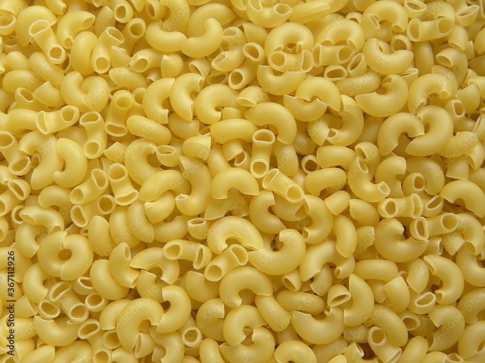 Yellow color raw dry Elbow Macaroni pasta Yellow color raw dry Elbow Macaroni pasta
