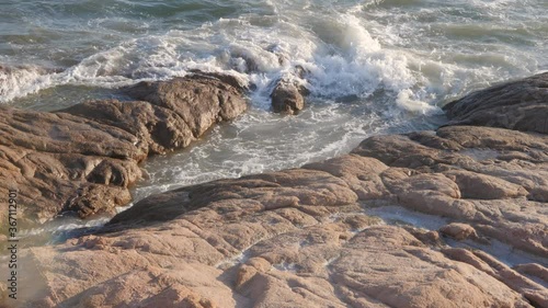 Beautiful shot of rock formations near the sea close to Beach Isola Rossa near Trinità d'Agultu and Vignola, Sardinia - Italy photo