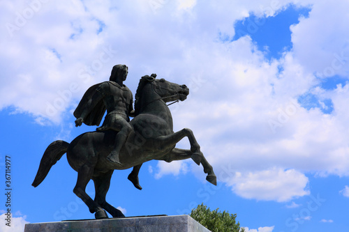  Alexander The Great statue against blue sky and clouds 