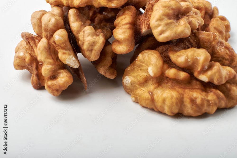 Walnut kernels are isolated on a white background. Walnut kernels are isolated on a white background.