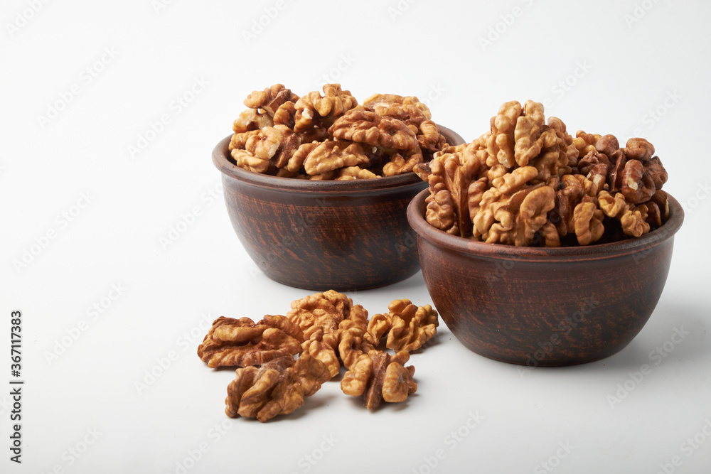Walnut kernels are isolated on a white background. Walnut kernels are isolated on a white background.
