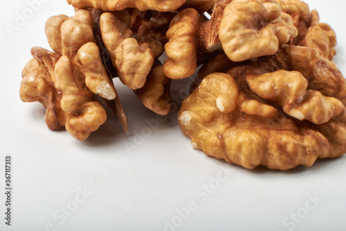 Walnut kernels are isolated on a white background.