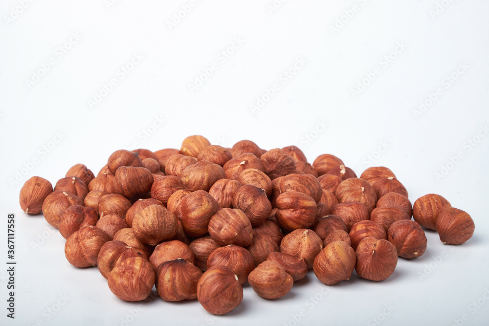 Walnut kernels on a wooden background.Almonds, walnuts and hazelnuts in bowls on a wooden background Walnut kernels on a wooden background.Almonds, walnuts and hazelnuts in bowls on a wooden background