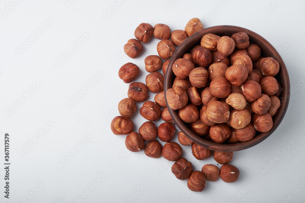 Walnut kernels on a wooden background.Almonds, walnuts and hazelnuts in bowls on a wooden background Walnut kernels on a wooden background.Almonds, walnuts and hazelnuts in bowls on a wooden background