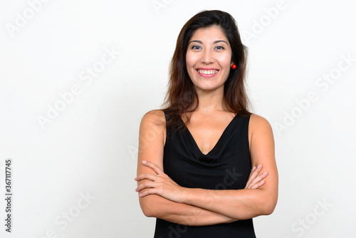 Portrait of happy young beautiful woman smiling with arms crossed