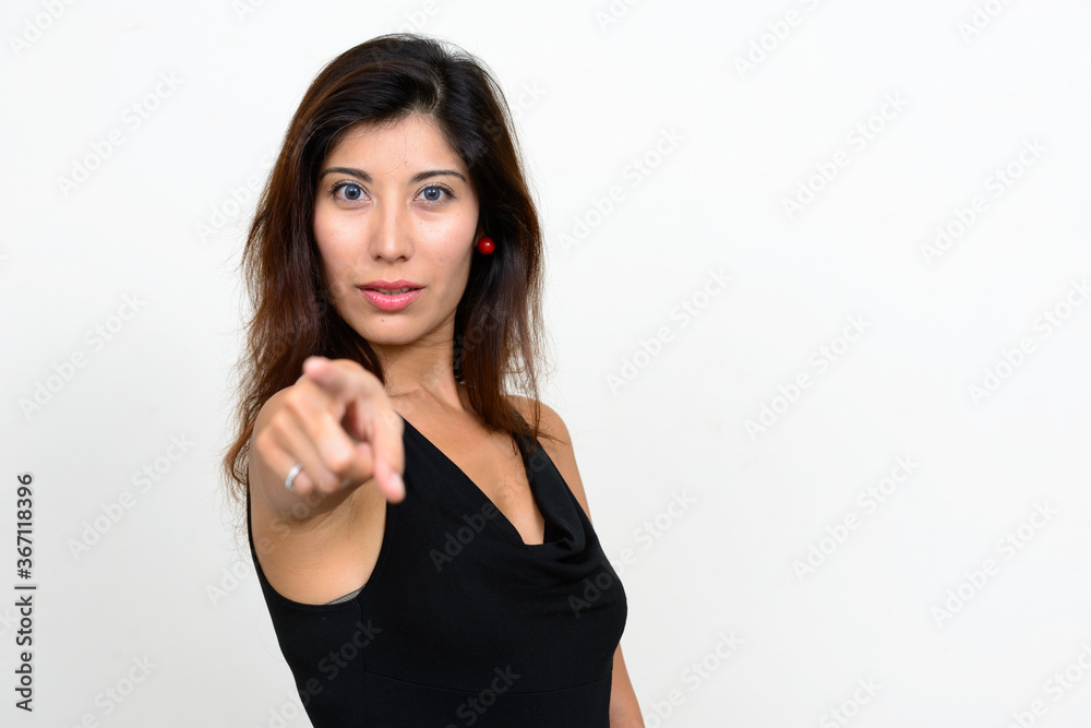 Portrait of young beautiful woman pointing at camera Portrait of young beautiful woman pointing at camera