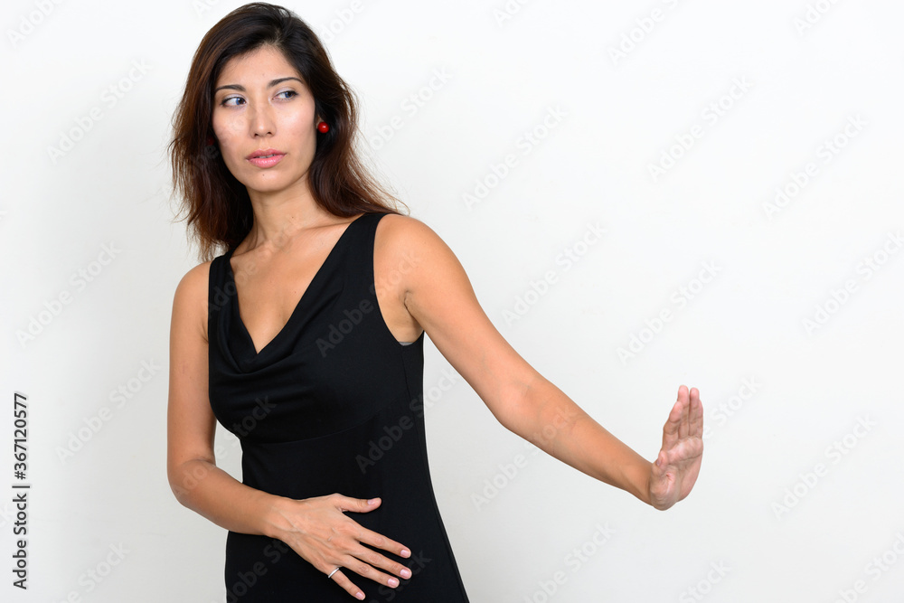 Portrait of stressed young woman showing stop gesture Portrait of stressed young woman showing stop gesture