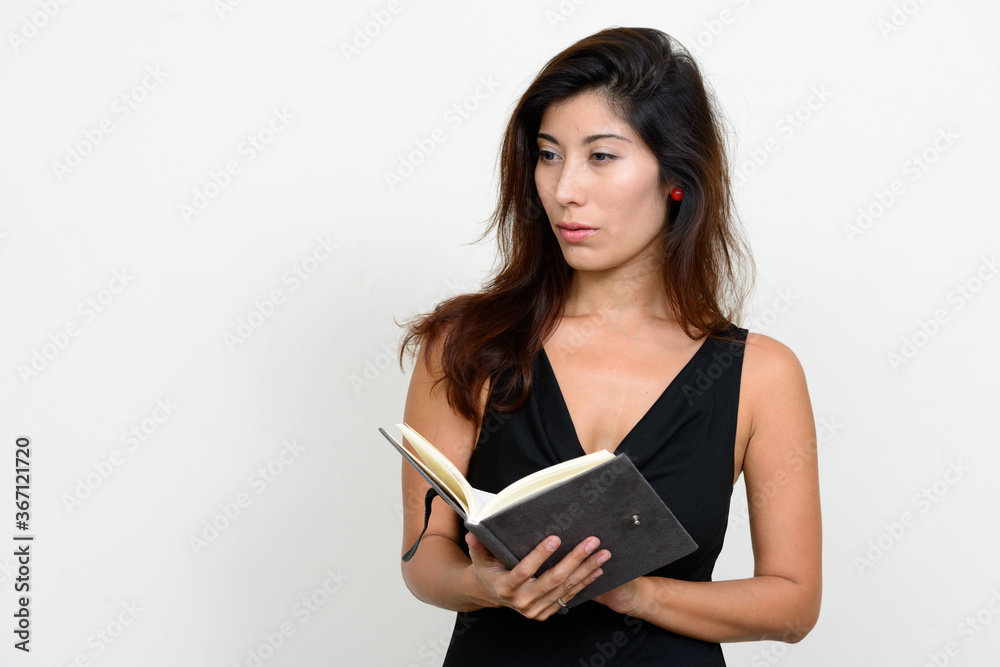 Portrait of young beautiful woman reading book Portrait of young beautiful woman reading book