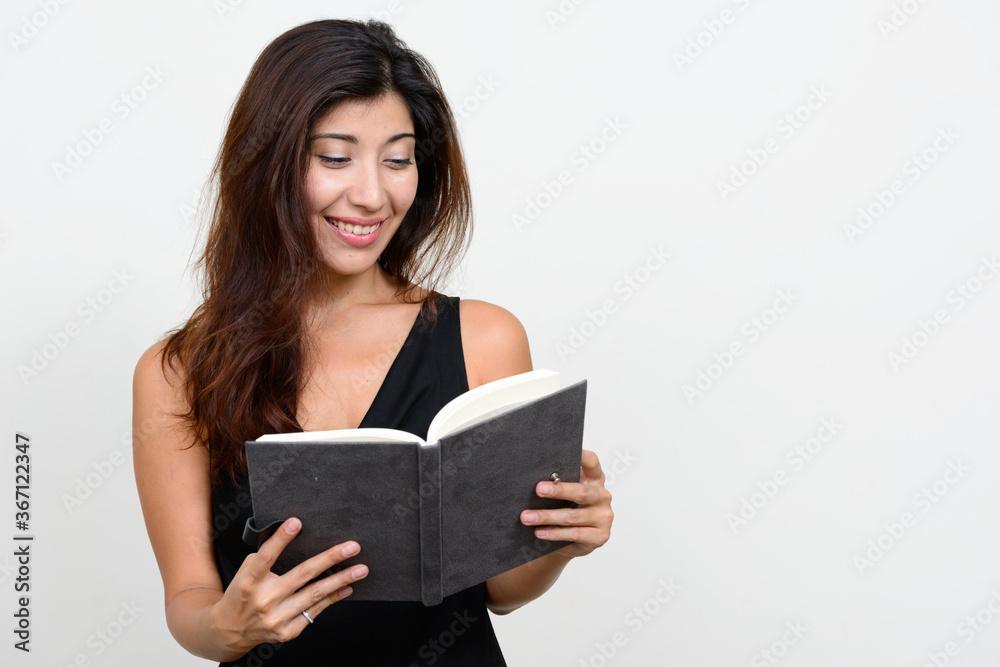 Portrait of happy young beautiful woman reading book Portrait of happy young beautiful woman reading book
