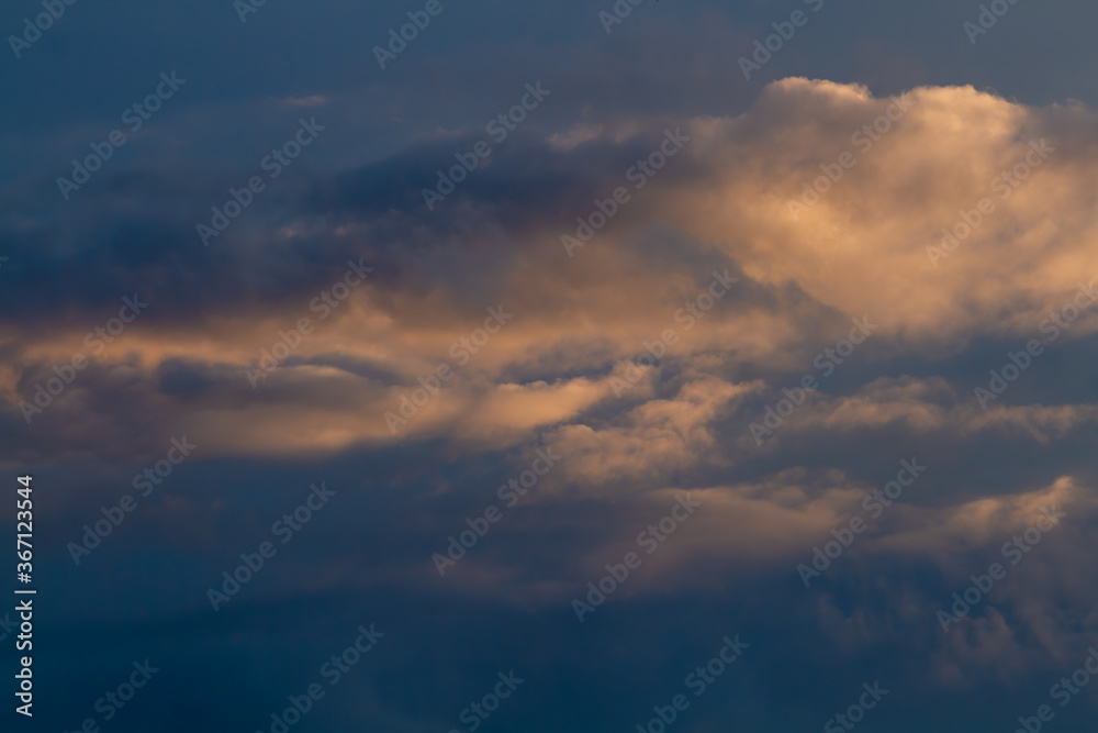 Fototapeta premium Dark blue sky, close-up cumulus clouds. Natural background.