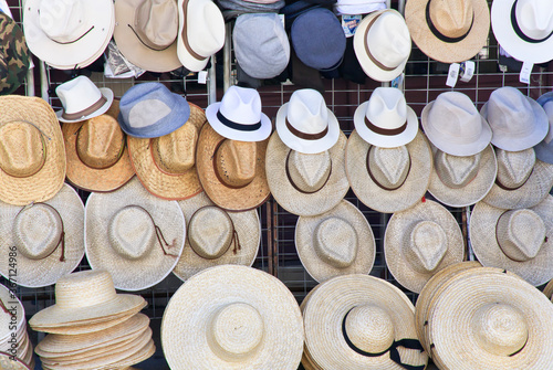 Various hats hanging on souvenir shop