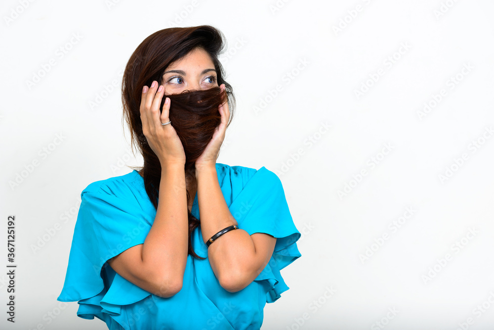 Portrait of young beautiful businesswoman covering face with hair Portrait of young beautiful businesswoman covering face with hair