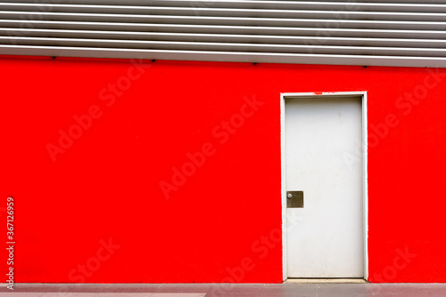 Photography Closed door on red wall background at Kuala Lumpur with copyspace