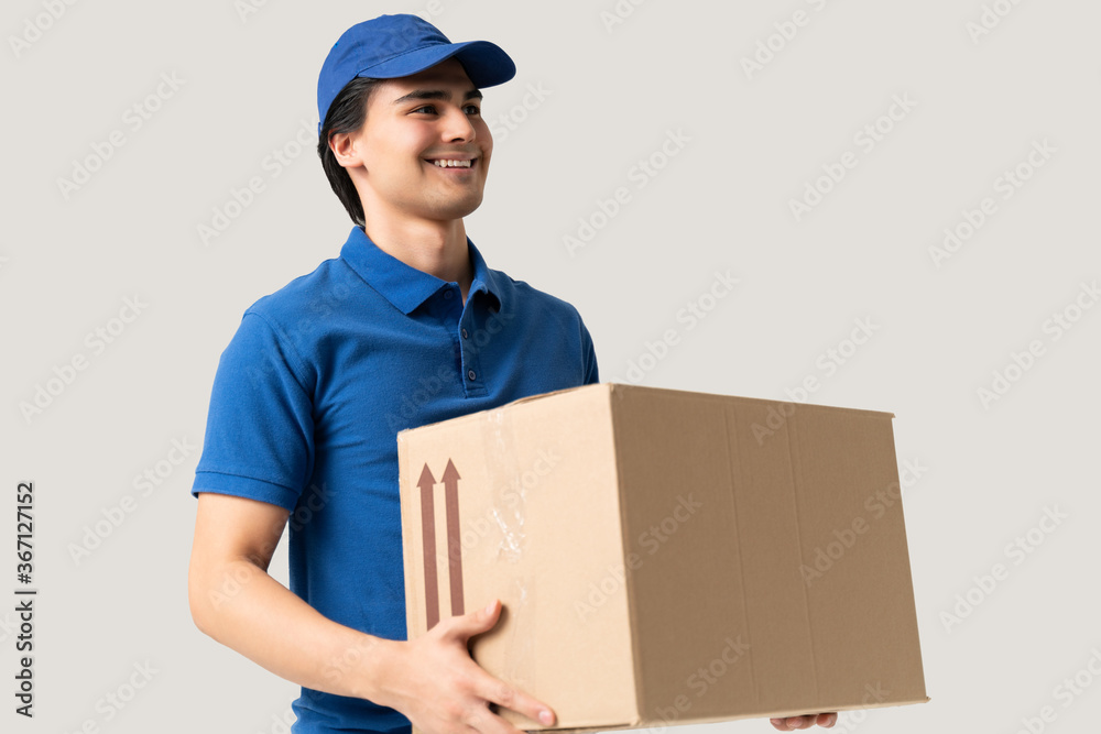 Smiling Delivery Man Carrying Cardboard Box Smiling Delivery Man Carrying Cardboard Box