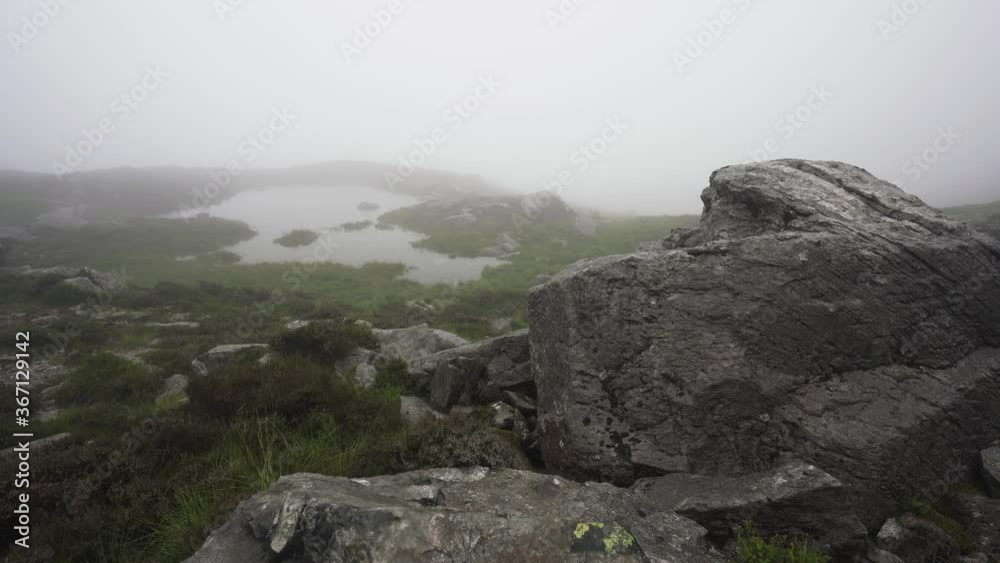 Snowdonia mountain view with a lake and misty weather Snowdonia mountain view with a lake and misty weather