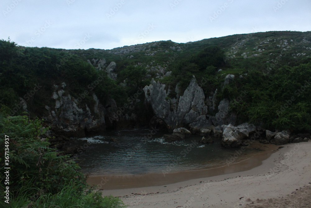 river in the mountains (Gulpiyuri beach, Asturias, Spain)