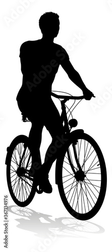 A bicycle riding bike cyclist in silhouette