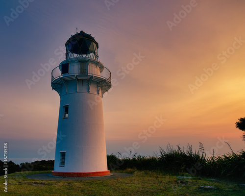 East Cape lighthouse is on the eastern tip of the North Island of New Zealand. This photograph was taken at sunset during summer.