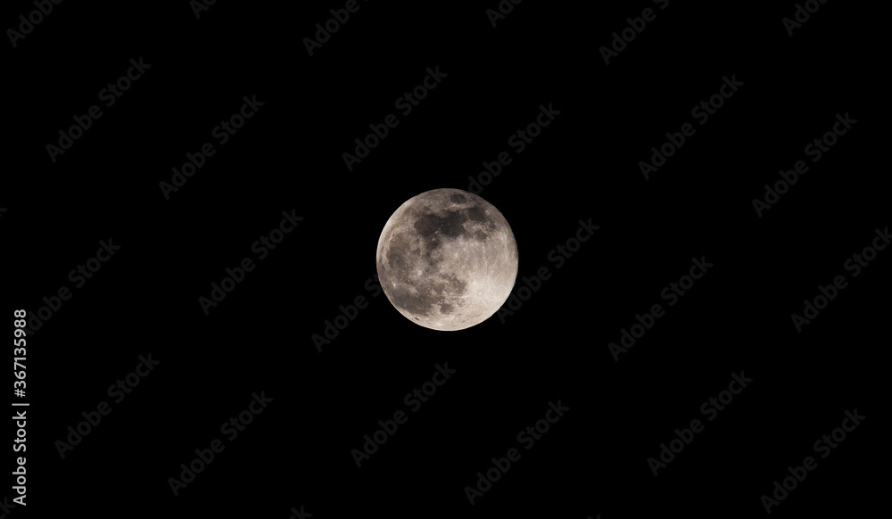 Moon against a dark sky. Moon against a dark sky.