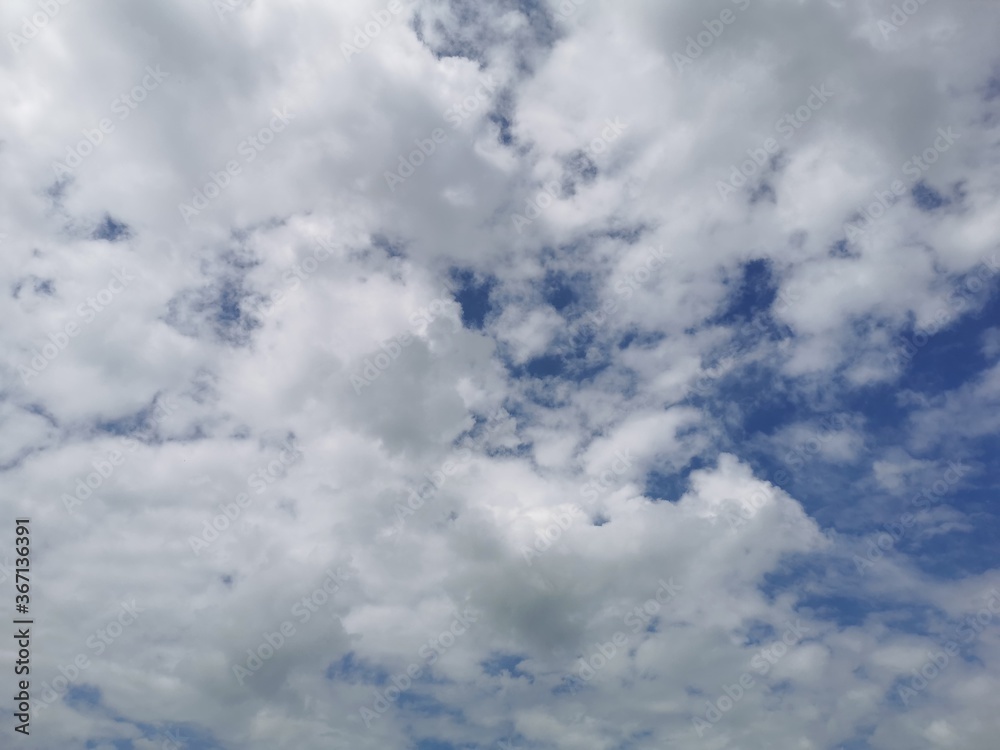 Fluffy clouds spread in the sky,
Beautiful nature. Fluffy clouds spread in the sky,
Beautiful nature.