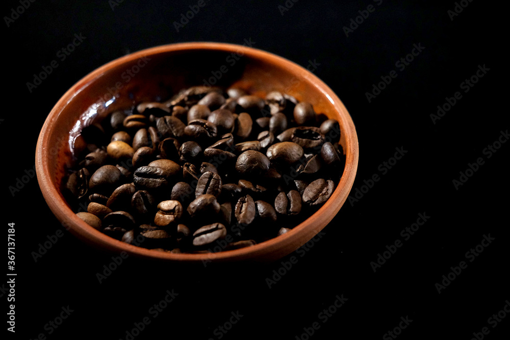 coffee in a clay cup on black velvet