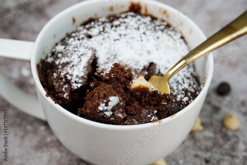 Microwave  Chocolate mug cake under one minute, selective focus photo