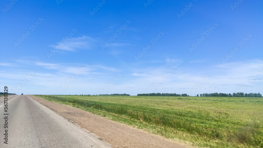 Ufa, Russia June 20, 2020 view from a driving car to the road on a sunny day
