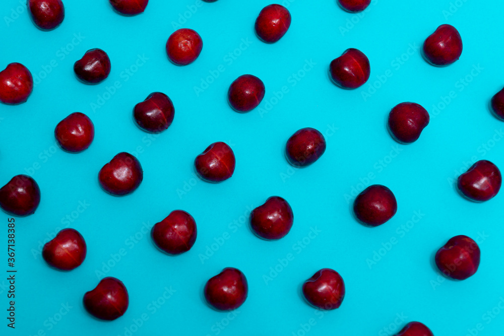delicious fresh cherries on blue background delicious fresh cherries on blue background