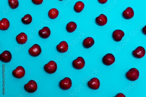 delicious fresh cherries on blue background