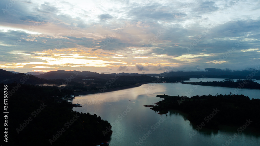 Aerial view of Kenyir Lake during blue hour sunrise.