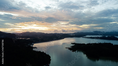 Aerial view of Kenyir Lake during blue hour sunrise.