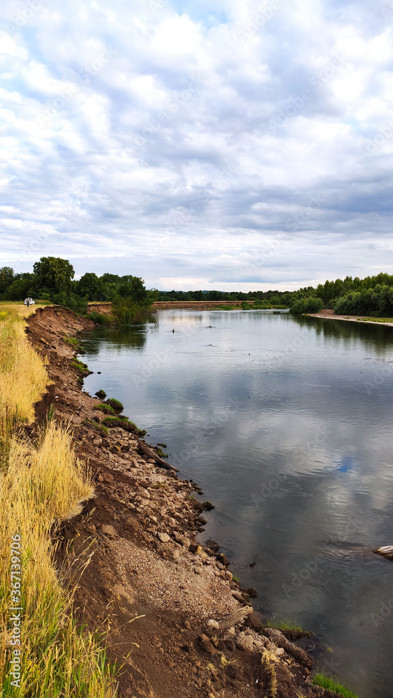 Ufa, Russia June 20, 2020 view of the reservoir on a sunny evening with clouds