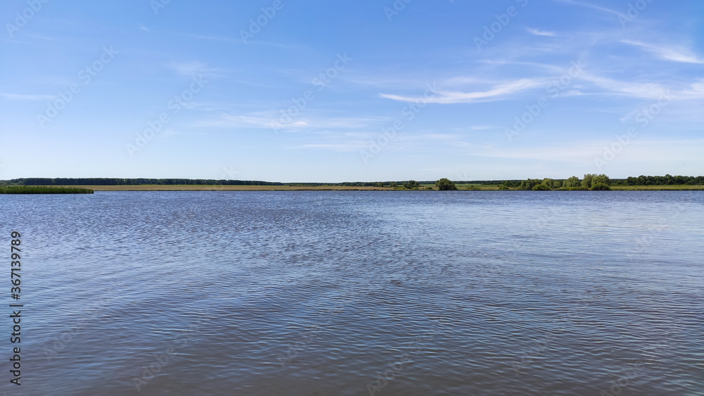 Ufa, Russia June 20, 2020 view of the reservoir on a sunny evening with clouds