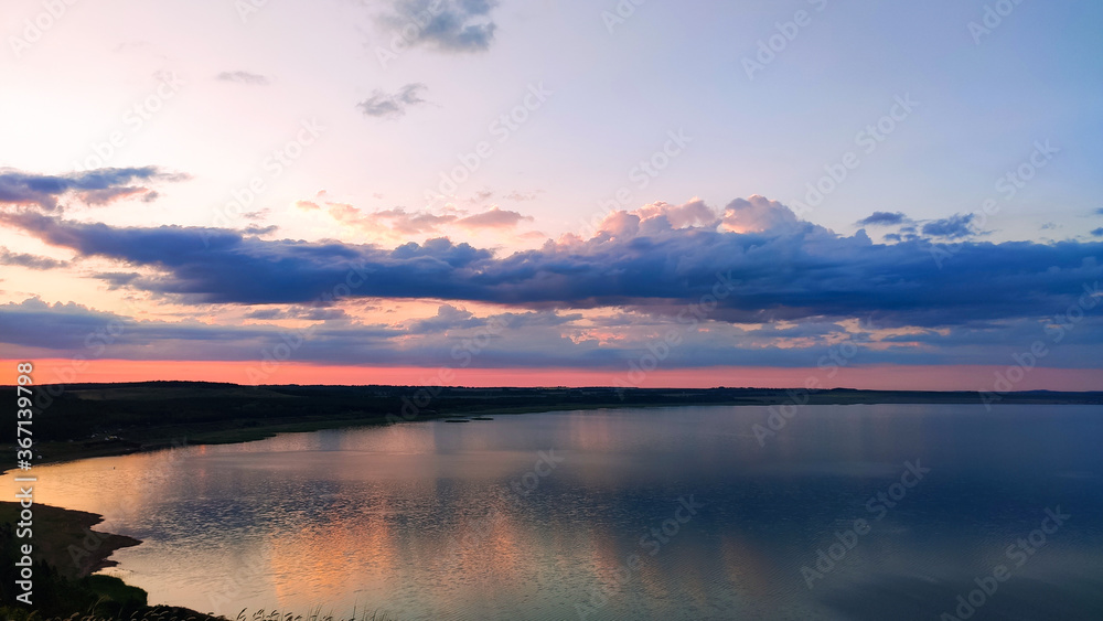 Ufa, Russia June 20, 2020 view of the reservoir on a sunny evening with clouds