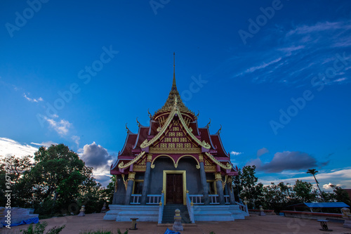 Background of Wat Pha Tak Suea, which is located on a mountain and offers views of neighboring countries such as Laos, the Mekong River, beautiful pagodas and churches for tourists to make merit. © bangprik