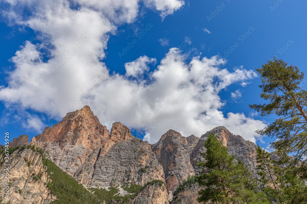 Bottom up view of the Italian Dolomites against the of clear blue sky
