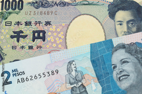 Wallpaper Mural A macro image of a Japanese thousand yen note paired up with a blue two thousand bank note from Colombia.  Shot close up in macro. Torontodigital.ca