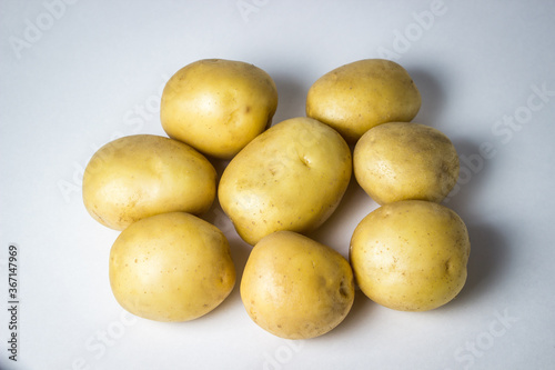 A bunch of potatoes on a white background. New potatoes. Harvesting. Agriculture