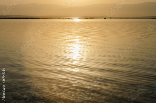 sunrise over the sea with sunlight reflection on water