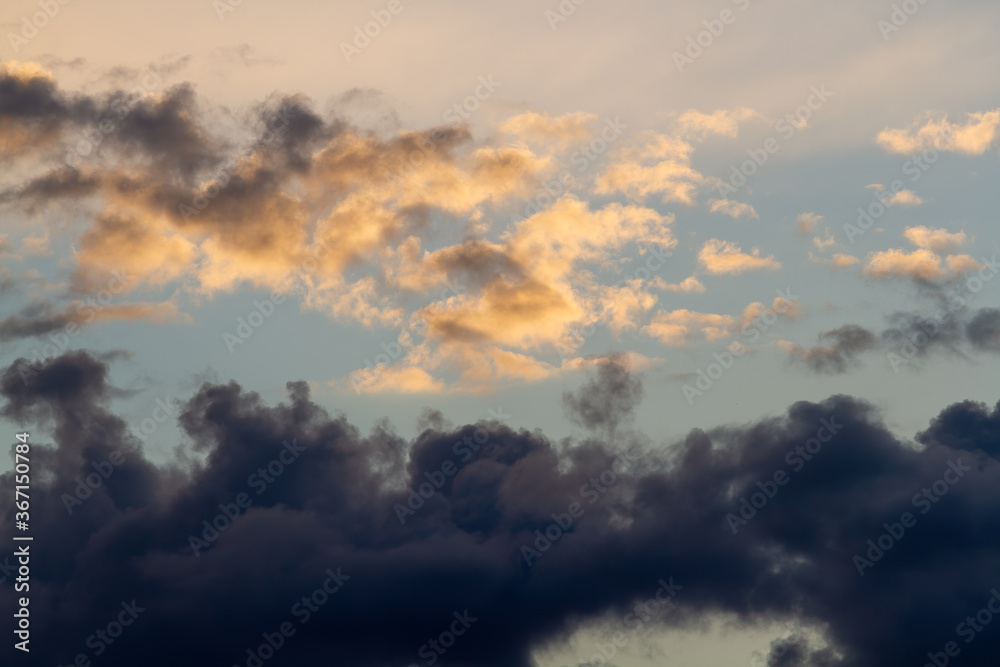 Dark clouds, blue sky. Natural background.