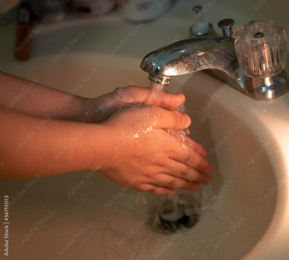 Fototapeta premium washing hands with soap 