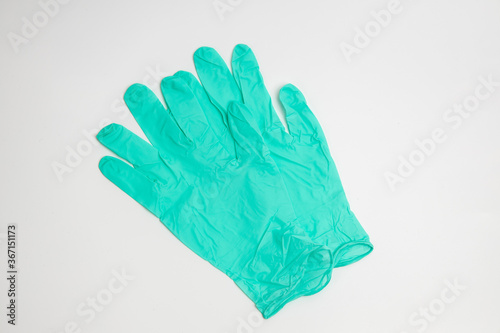 green rubber glove isolated on white background © Teerapong